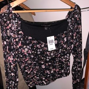 Long sleeve , flowy arm fabric, built in bra padding , floral
